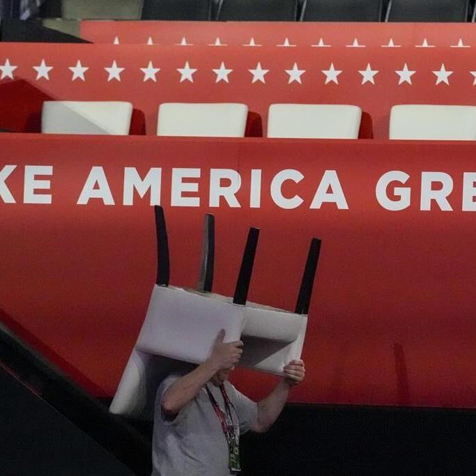 Donald Trump enters Republican convention hall with a bandaged ear and gets a hero's welcome